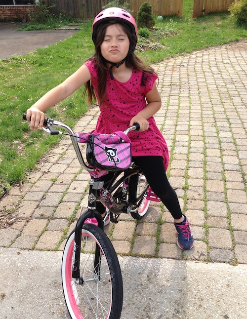 Maya riding her bike