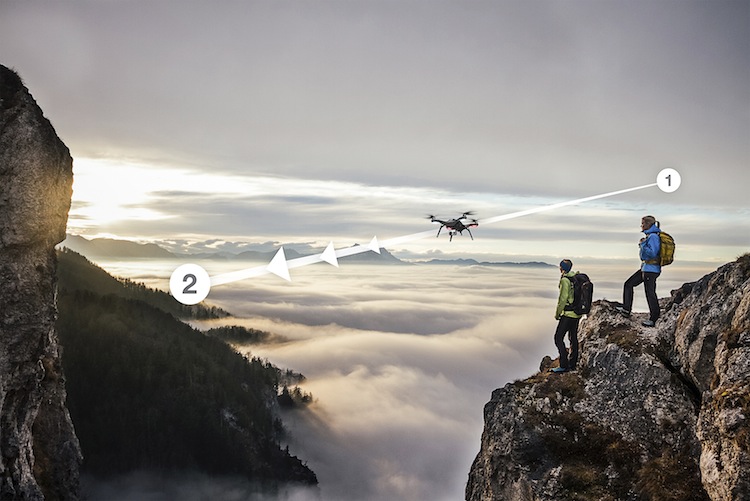 two female hikers above the sea of fog on top of a mountain